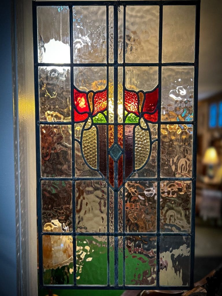 This stunning Large Stained Glass Panel features vibrant colors and intricate craftsmanship, perfect for adding timeless elegance to any space or decor.